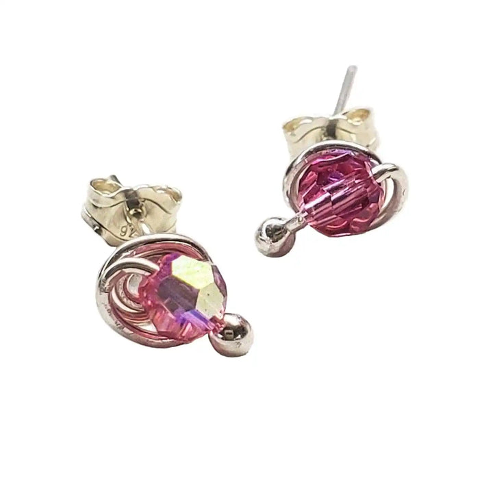 4mm handmade silver crystal spiral ear studs featuring pink Swarovski crystals in elegant handcrafted design.