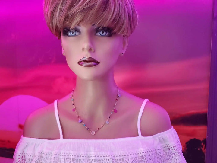 Adjustable Golden Wire Wrapped Kunterbunt Gemstone Necklace displayed on a mannequin with a colorful background.