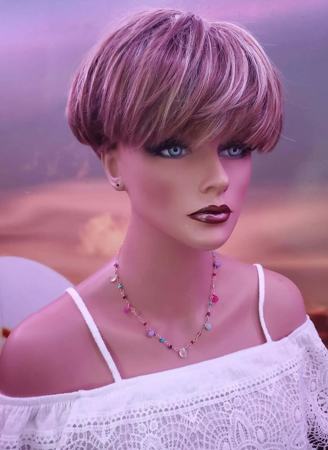 Adjustable Golden Wire Wrapped Kunterbunt Gemstone Necklace worn by a mannequin with stylish short hair.