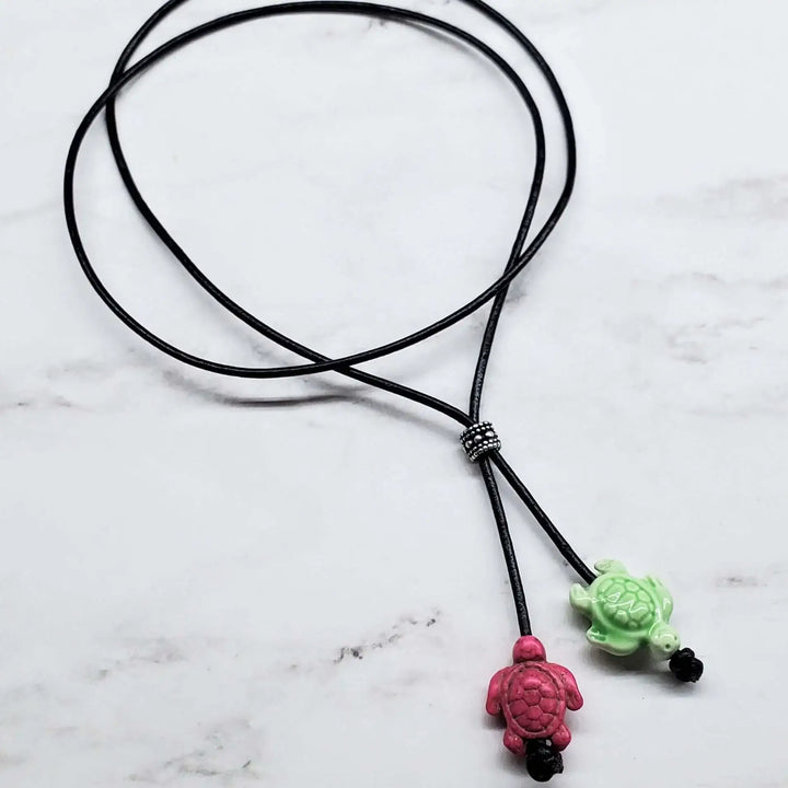 AMD1318-2Handmade Black Leather Colored Ceramic Talking NecklaceJewelryNecklace$ 25.00Alexa Martha Designs