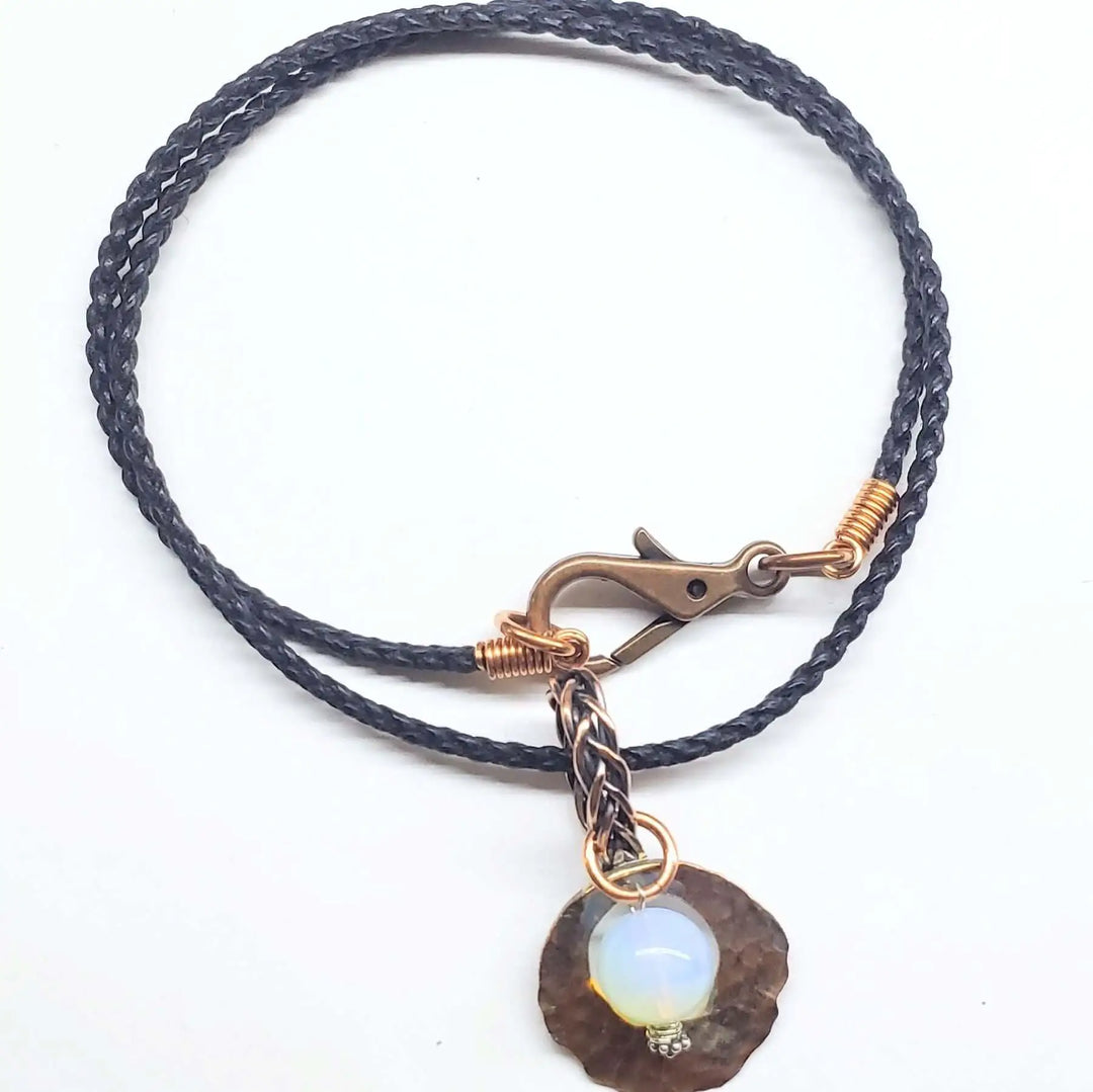 Handmade copper wire braided bail gemstone necklace featuring a Luminite gemstone and a unique clasp.