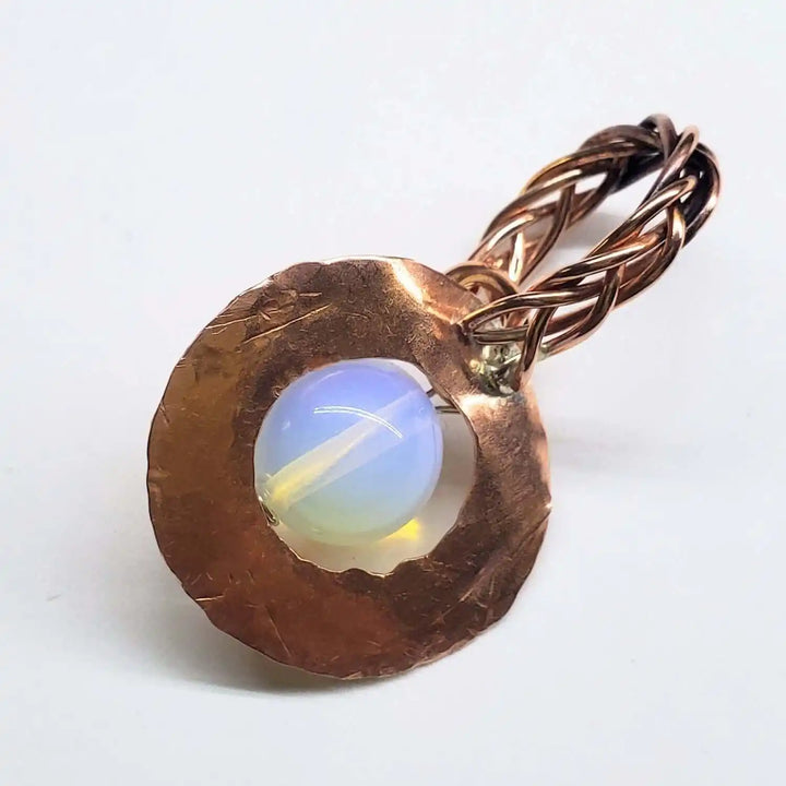 Handmade copper wire braided bail gemstone necklace featuring a rare Luminite gemstone.