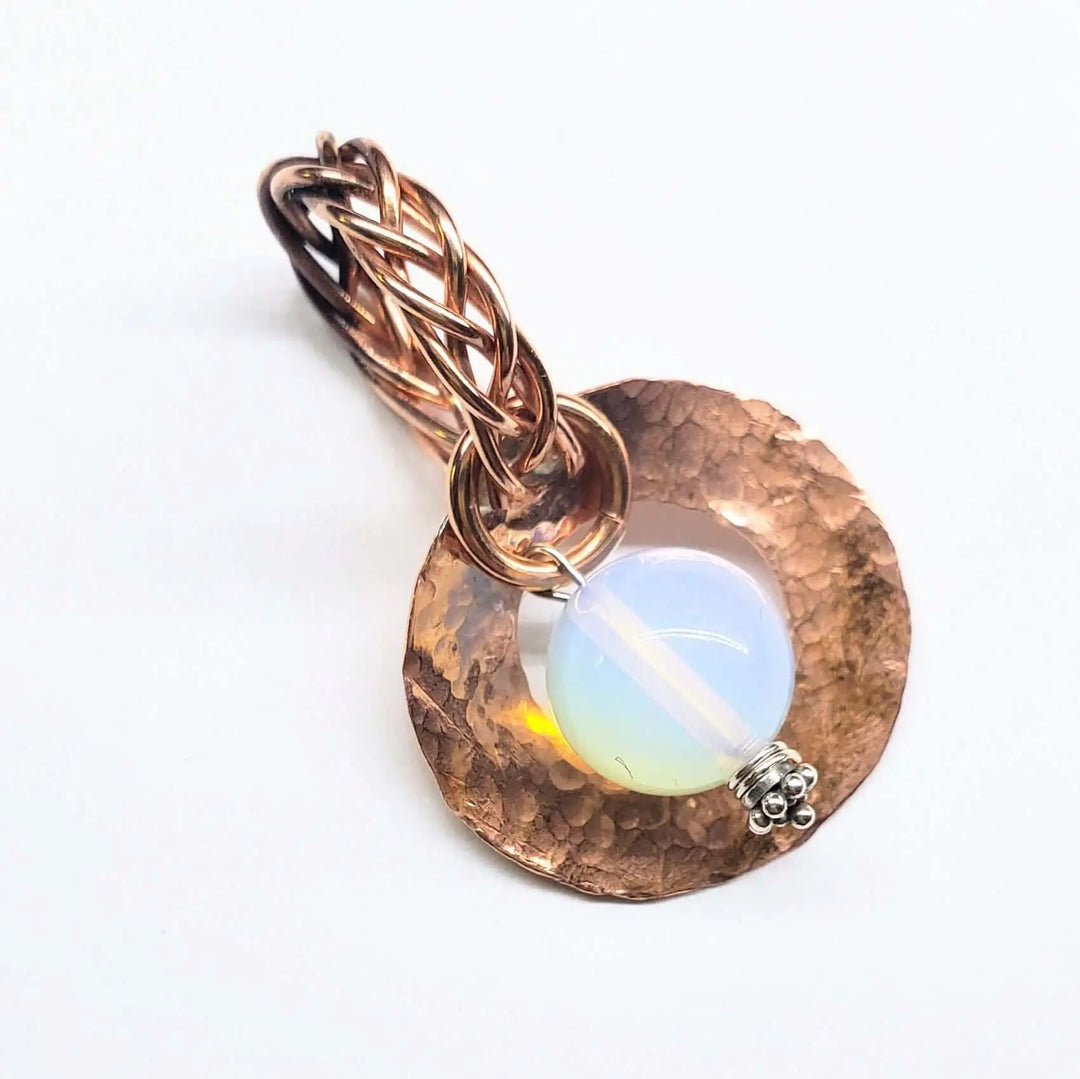 Handmade copper wire braided bail gemstone necklace featuring a rare Luminite gemstone.