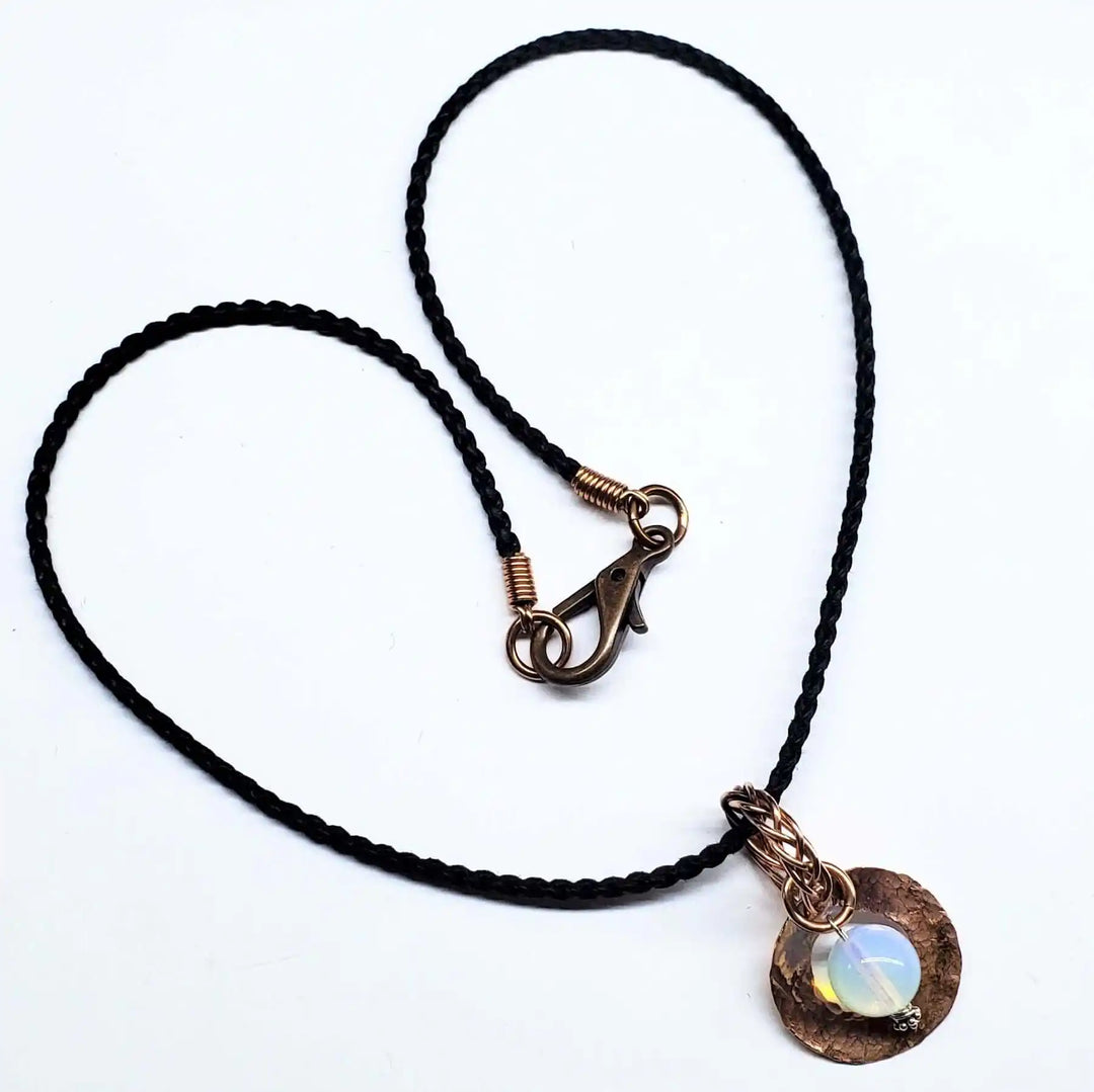 Handmade copper wire braided bail gemstone necklace featuring a rare Luminite gemstone pendant.