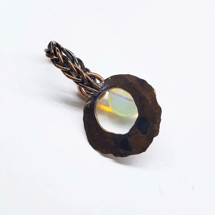 Handmade copper wire braided bail gemstone necklace featuring rare Luminite gemstone with unique design.