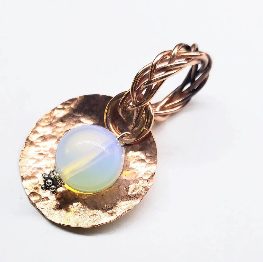 Handmade copper wire braided bail gemstone necklace featuring rare Luminite gemstone on a hammered copper pendant.