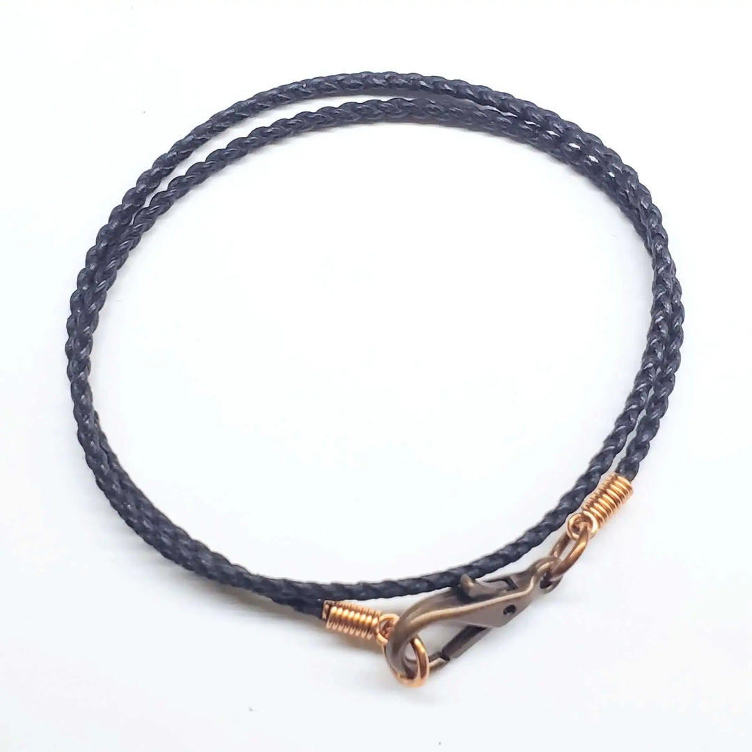 Handmade copper wire braided bail gemstone necklace featuring a stylish clasp and intricate braided design.