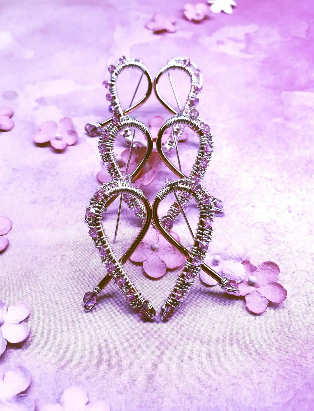 Handmade Copper Silver Pink Crystal Ribbon Jewelry Set displayed on a purple background with decorative flowers.