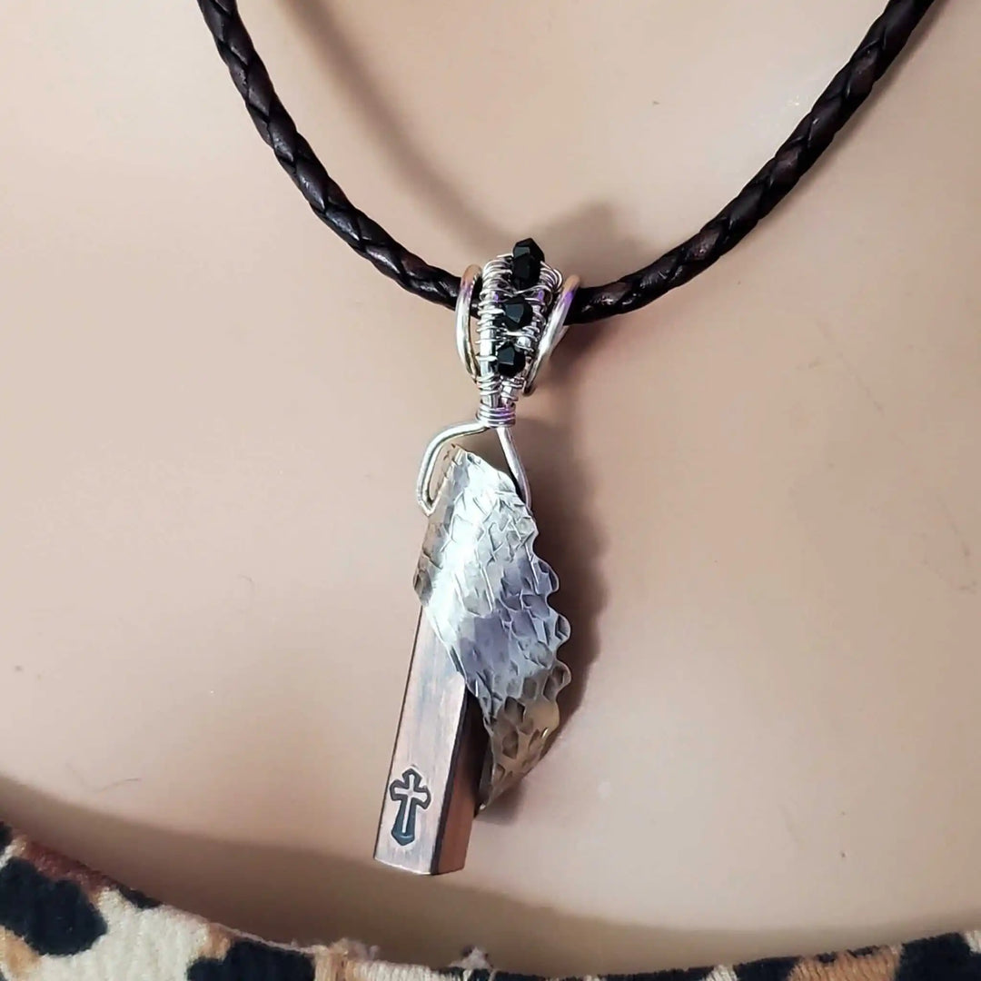 Sculpted Memorial Angelwing Necklace - Limited Edition featuring a silver angel wing pendant on braided leather cord.