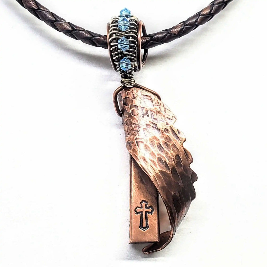 Sculpted Copper Angelwing Crystal Birthstone Necklace featuring a handcrafted copper angel wing pendant with a Swarovski crystal.