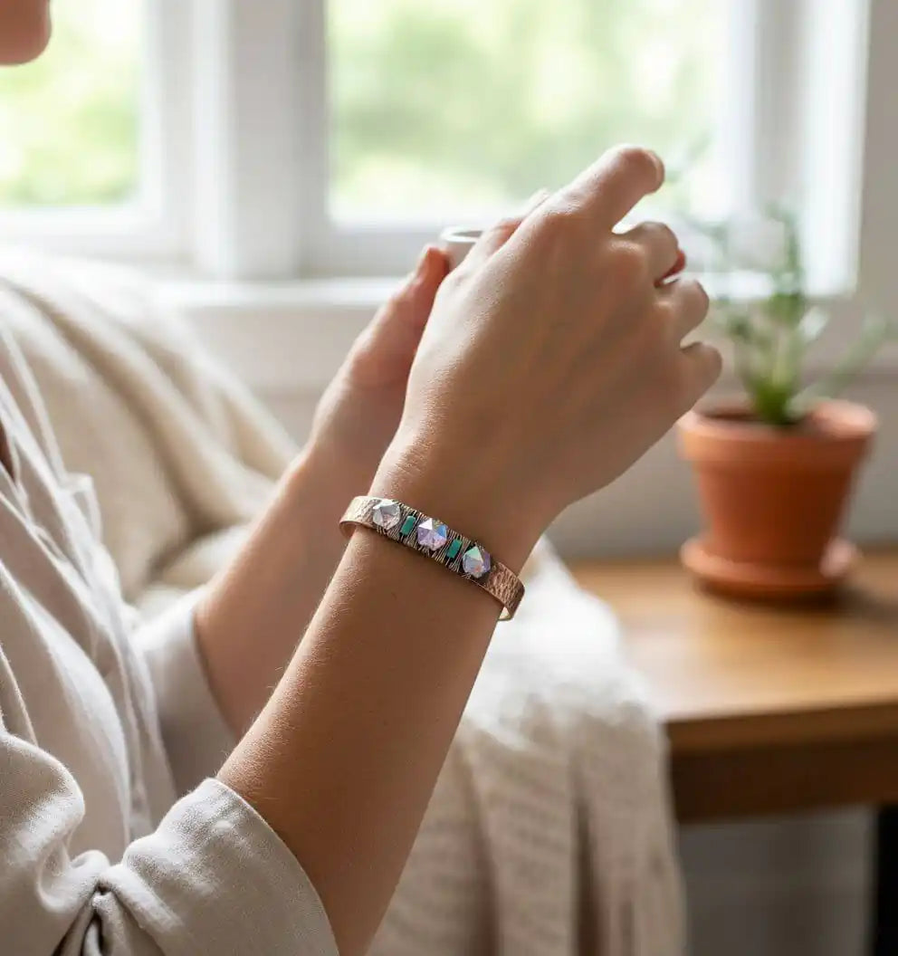 Handmade Copper Turquoise Crystal Spike Cuff worn on wrist, showcasing its unique design with colorful crystals.