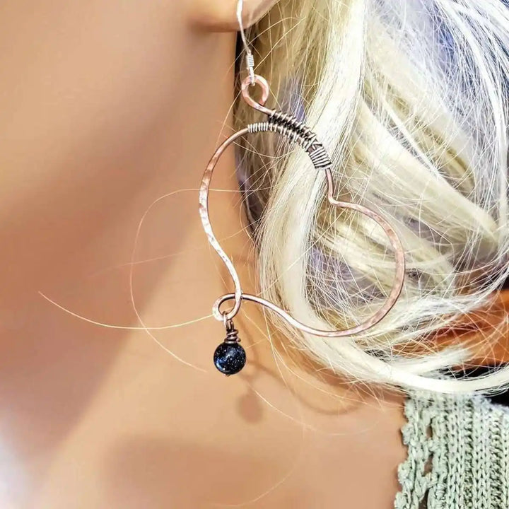 Sculpted Copper Butterfly Wing Abuse Survivor Earrings featuring copper hoops and black Swarovski crystal dangles.