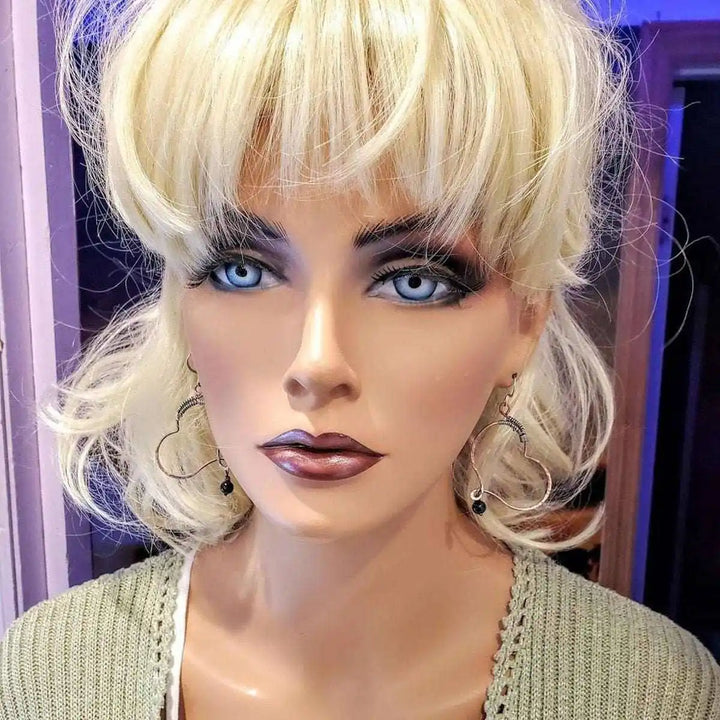 Sculpted Copper Butterfly Wing Abuse Survivor Earrings displayed on a mannequin with blonde hair and stylish makeup.