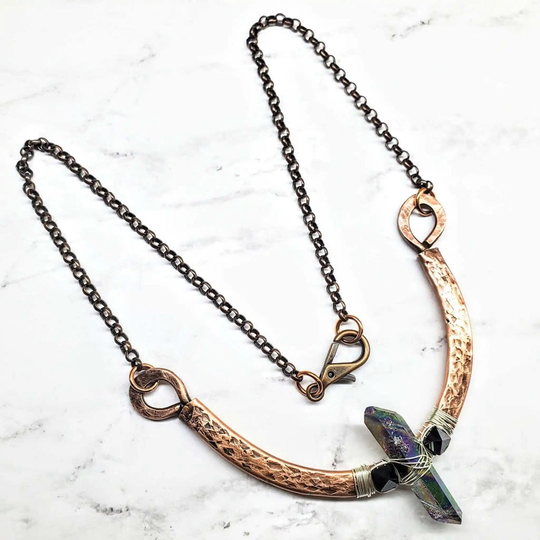 Hammered Sculpted Wire Wrapped Fight For The Truth Necklace featuring a raw titanium crystal and black Swarovski spikes.