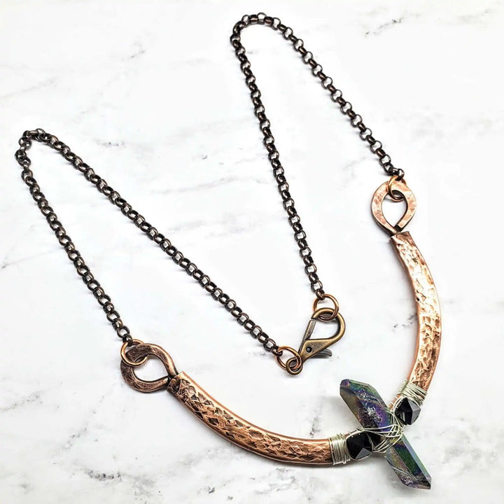 Hammered Sculpted Wire Wrapped Fight For The Truth Necklace featuring a raw titanium crystal and black Swarovski spikes.