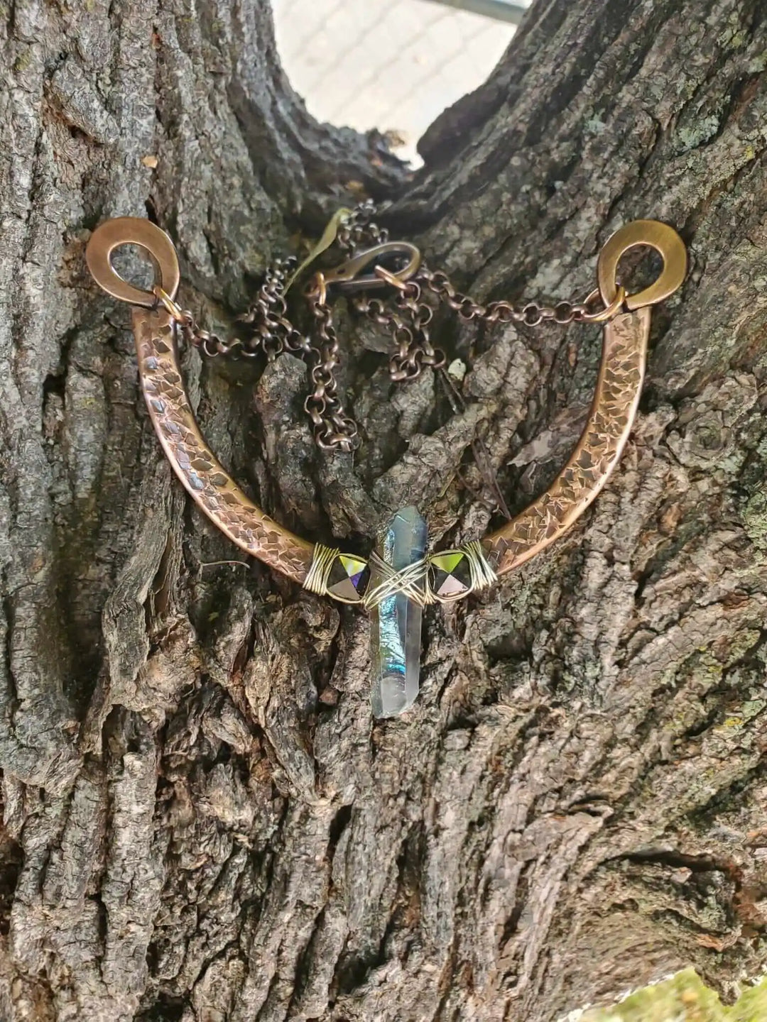 Hammered Sculpted Wire Wrapped Fight For The Truth Necklace featuring a raw titanium crystal and black Swarovski spikes.