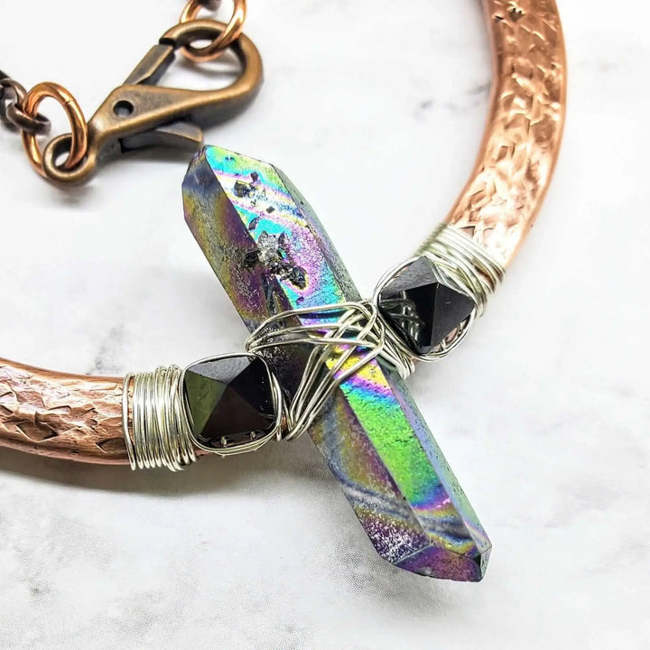 Hammered Sculpted Wire Wrapped Fight For The Truth Necklace featuring a raw titanium crystal and black Swarovski spike crystals.