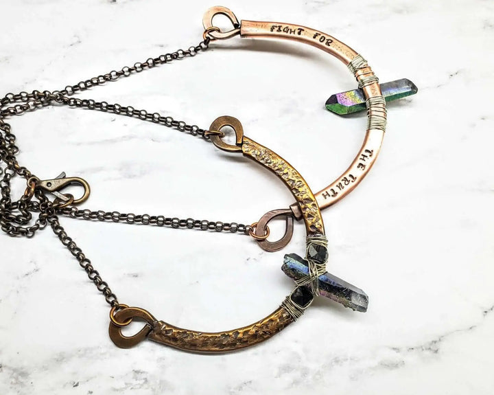 Hammered Sculpted Wire Wrapped Fight For The Truth Necklace showcasing raw titanium and Swarovski crystals.