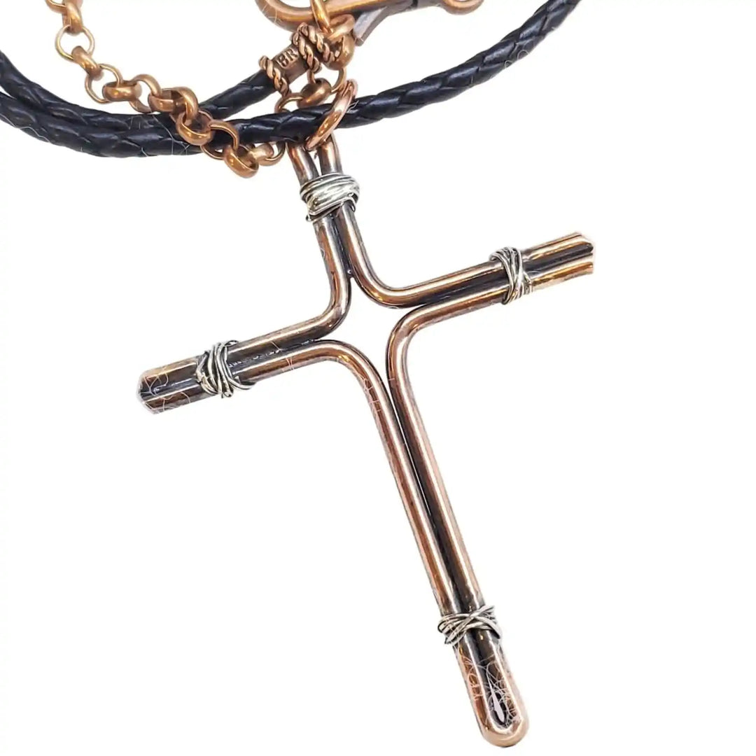 Handmade Large Copper and Silver Wire Cross Necklace for Men with leather cord, showcasing artisan craftsmanship.
