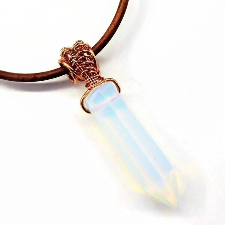 Handmade Rustic Wire Wrapped Gemstone Leather Necklace featuring a wire-wrapped pointed crystal on leather cord.