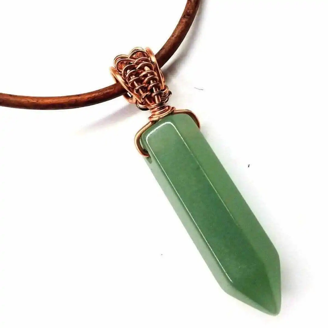 Handmade Rustic Wire Wrapped Gemstone Leather Necklace featuring a green pointed gemstone crystal on rustic leather cord.
