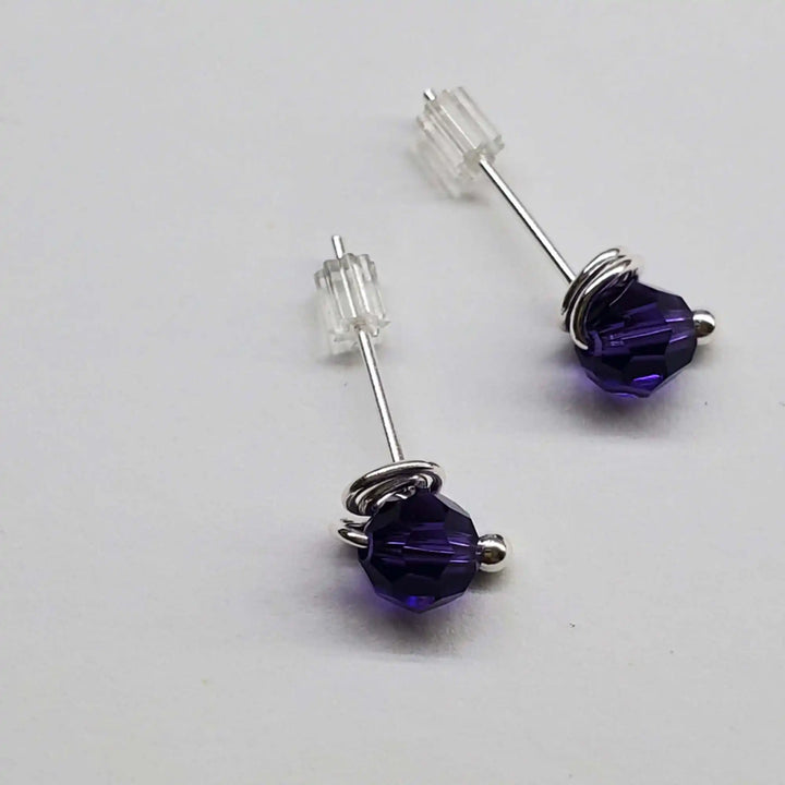 Handmade 6mm Silver Spiral Crystal Stud Earrings featuring purple Swarovski crystals with handcrafted silver spirals.