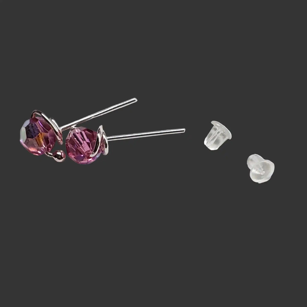 Handmade 6mm Silver Spiral Crystal Stud Earrings with purple crystals and clear backs.