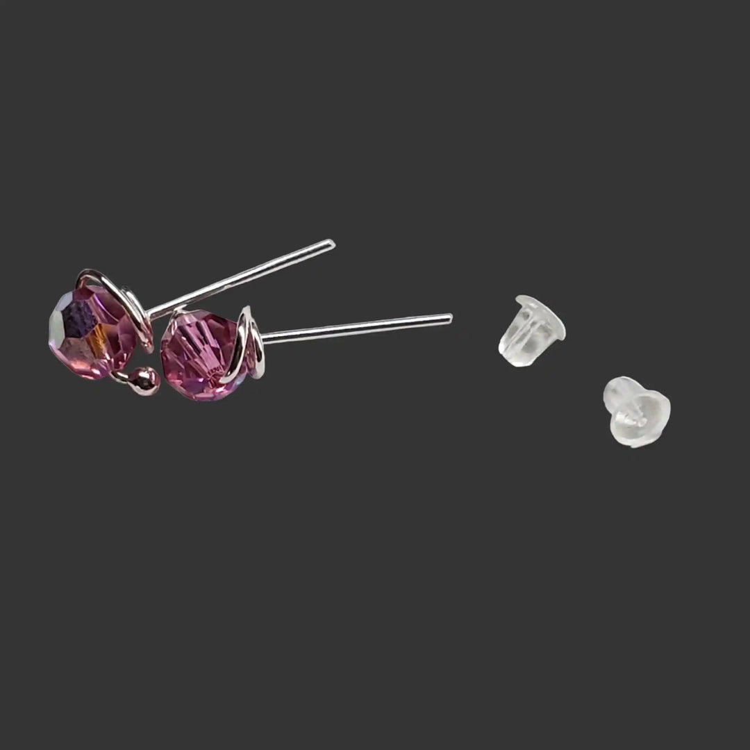 Handmade 6mm Silver Spiral Crystal Stud Earrings with purple crystals and clear backs.