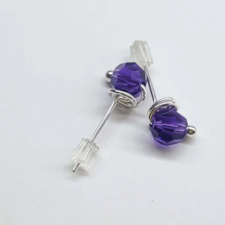 Handmade 6mm Silver Spiral Crystal Stud Earrings featuring purple Swarovski crystals in silver spirals.