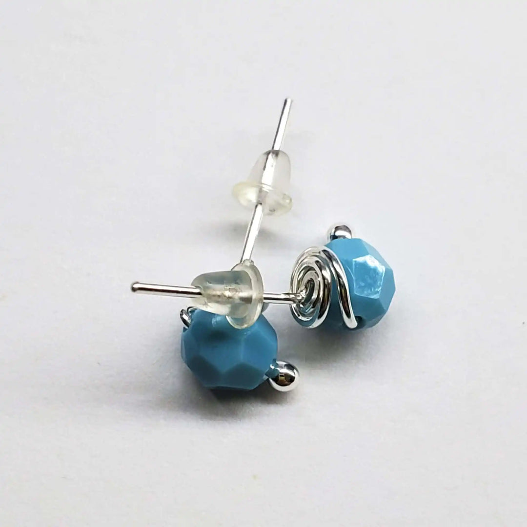 Handmade 6mm Silver Spiral Crystal Stud Earrings showcasing blue crystal beads and silver spirals for everyday elegance.