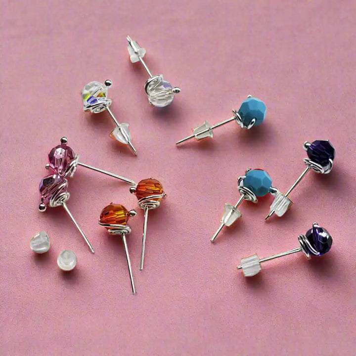 Handmade 6mm Silver Spiral Crystal Stud Earrings in various colors with sparkling crystals and silver settings.