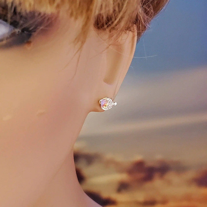 Handmade 6mm Silver Spiral Crystal Stud Earrings showcased on a model, featuring a sparkling Swarovski crystal.