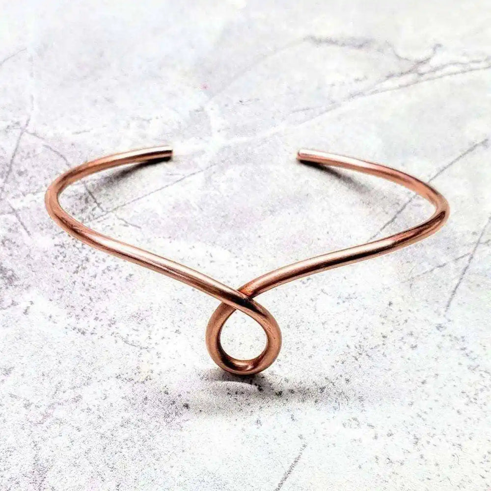 Handmade Sculpted Copper Teardrop Bangle showcasing unique teardrop design in sturdy 10-gauge copper wire.