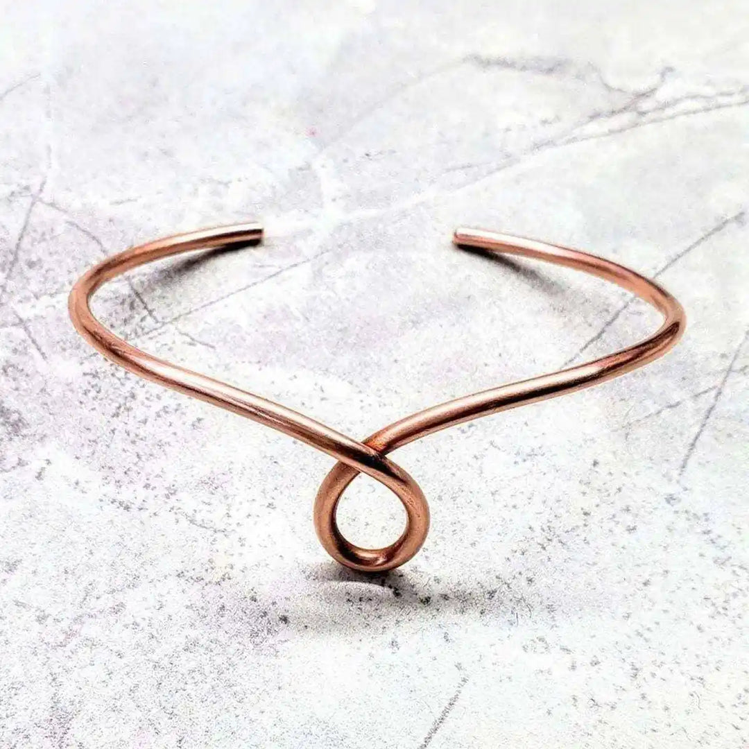 Handmade Sculpted Copper Teardrop Bangle showcasing unique teardrop design in sturdy 10-gauge copper wire.