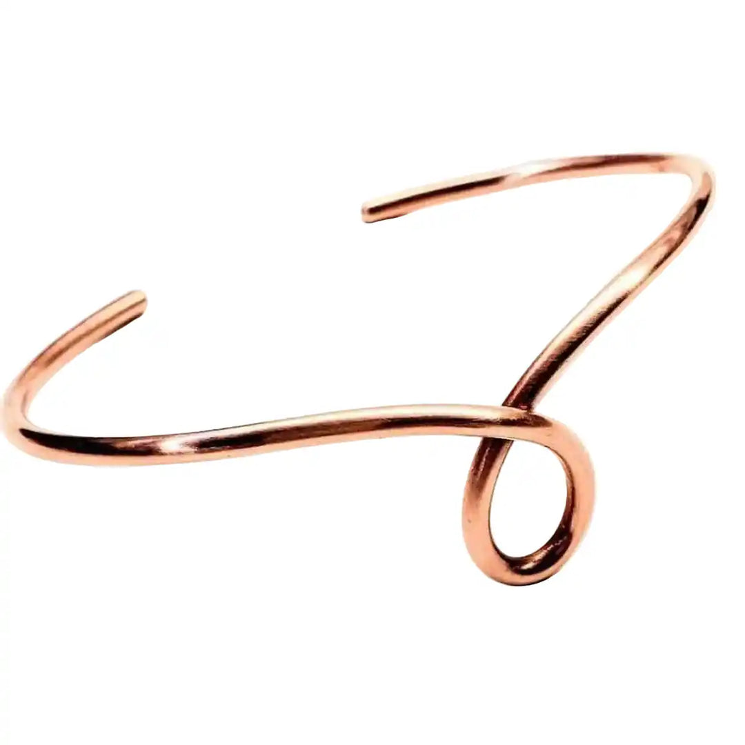 Handmade Sculpted Copper Teardrop Bangle showcasing a unique teardrop design crafted from sturdy copper wire.