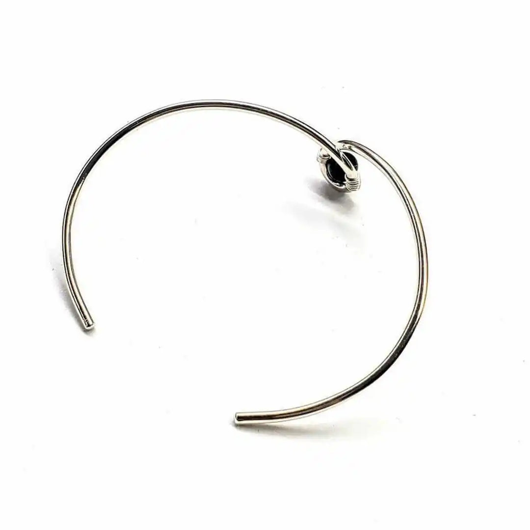 Silver Blue Bead Child Abuse Awareness Ribbon Bangle featuring a teardrop design with blue sandstone bead.