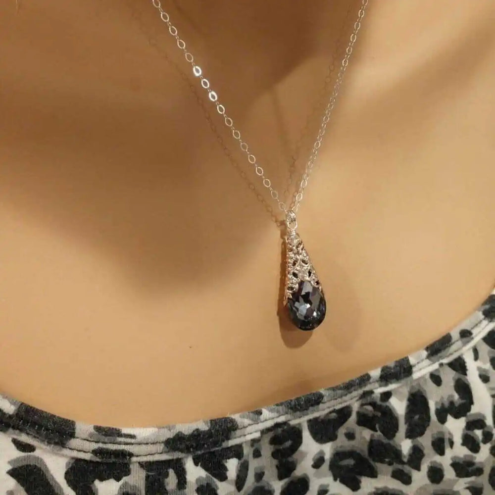 Handmade Sculpted Wrapped Rose Gold Filigree Crystal Necklace displayed on a mannequin with a black diamond crystal pendant.