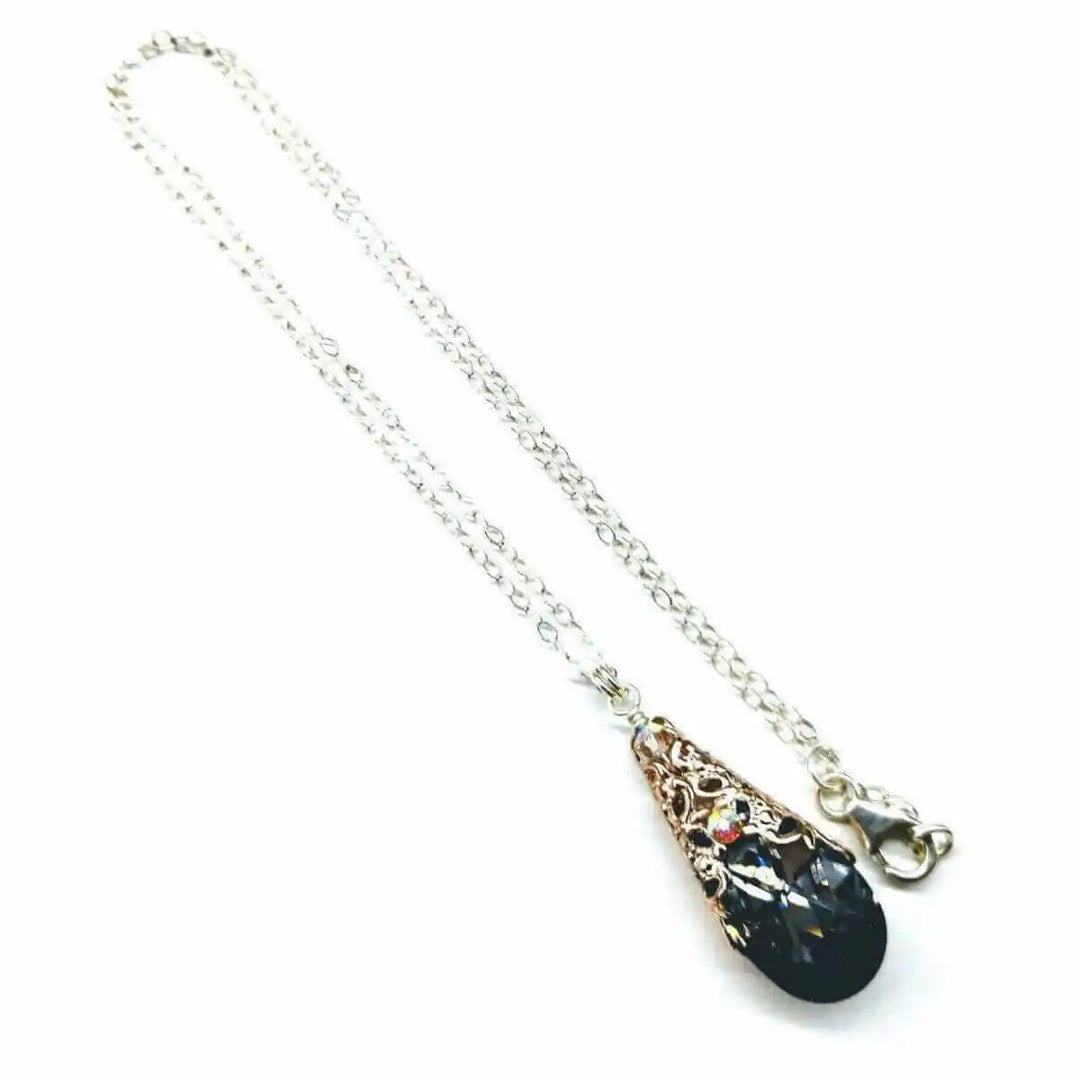 Handmade Sculpted Wrapped Rose Gold Filigree Crystal Necklace with a black diamond Swarovski crystal.