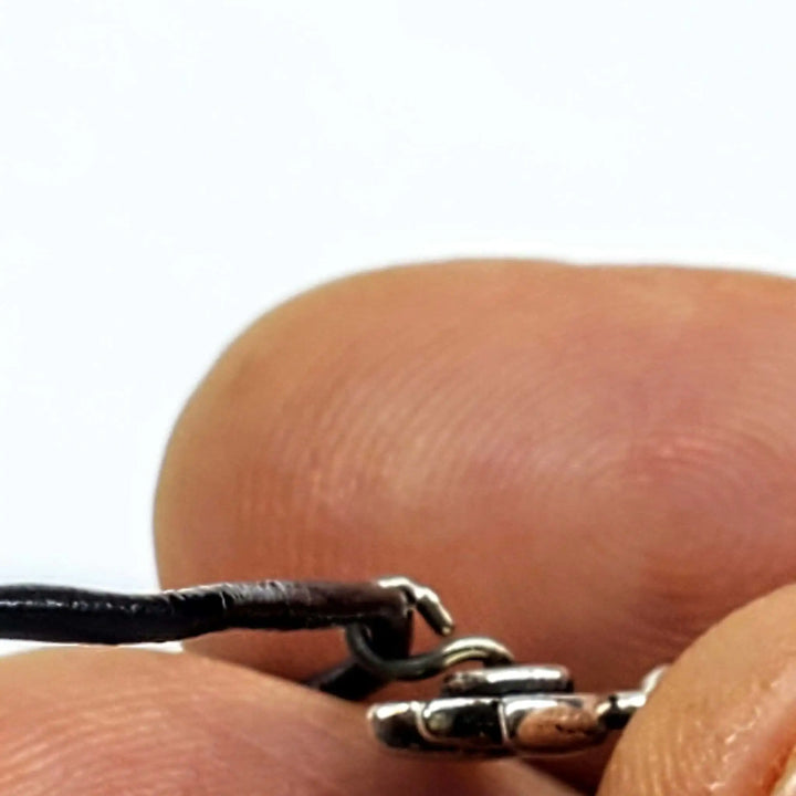 Close-up of the Handmade Silver Crystal Pineapple Leather Necklace showing the clasp detail.