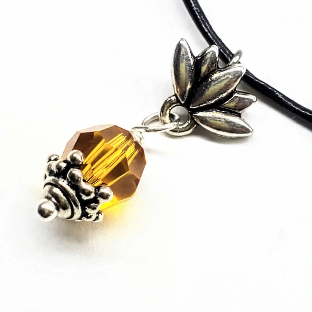 Handmade silver crystal pineapple leather necklace featuring a bright yellow Austrian Swarovski crystal and silver pineapple charm.