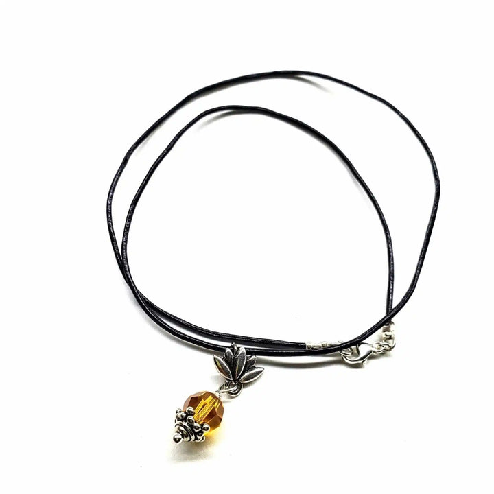 Handmade silver crystal pineapple leather necklace with sterling silver pineapple pendant and yellow Swarovski crystal.