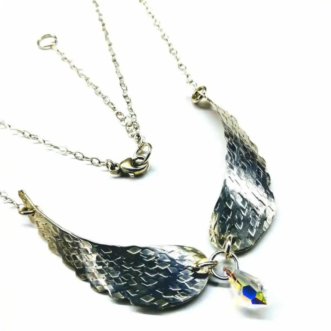 Handmade Silver Forged Sculpted Angel Wings Necklace with Swarovski crystal teardrop, original design by Alexa Martha.