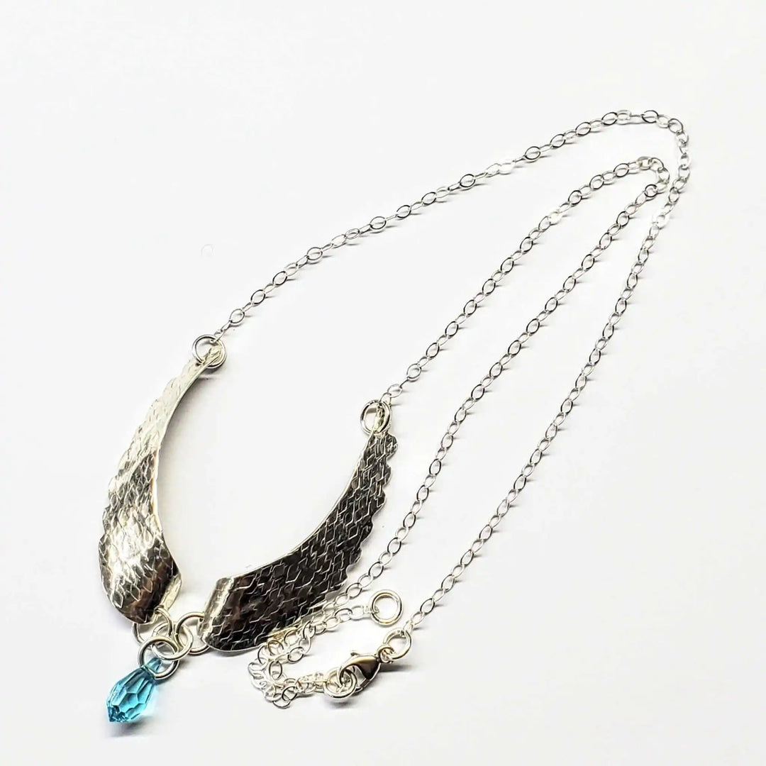 Handmade Silver Forged Sculpted Angel Wings Necklace with Swarovski crystal teardrop attached.