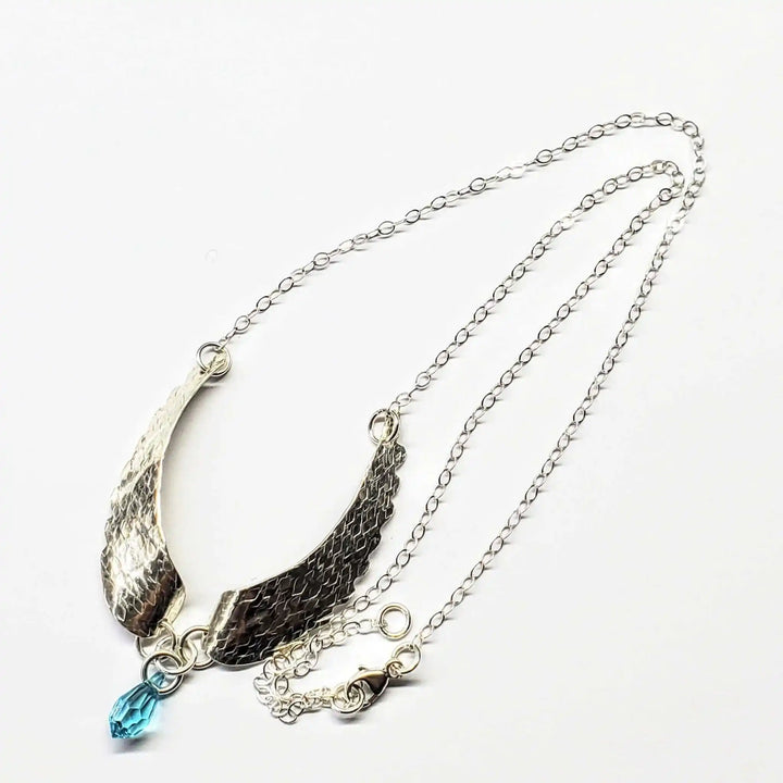 Handmade Silver Forged Sculpted Angel Wings Necklace with Swarovski crystal teardrop attached.