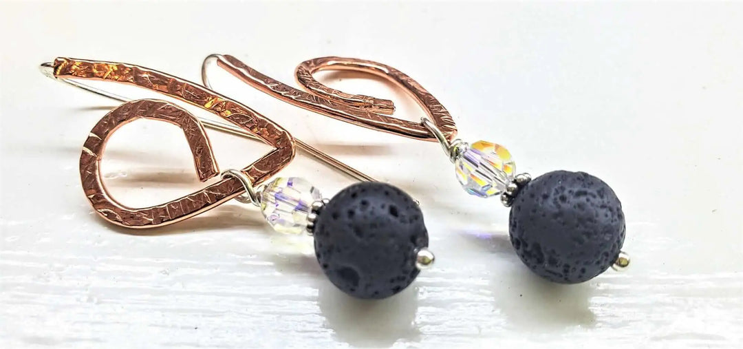 Embossed Copper Butterfly Wing Lava Rock Bead Earrings featuring black lava beads and sparkling crystals.