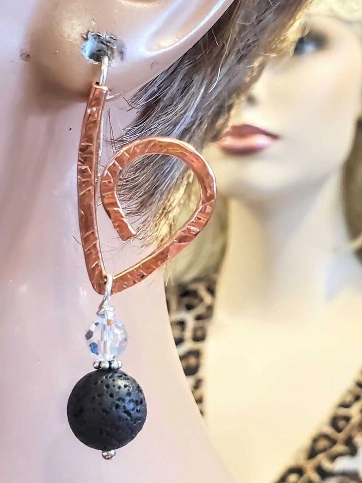 Embossed Copper Butterfly Wing Lava Rock Bead Earrings showcasing a unique heart design with lava rock bead and Swarovski crystal.