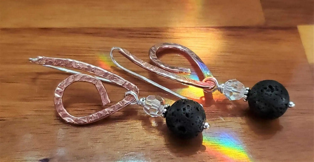 Embossed Copper Butterfly Wing Lava Rock Bead Earrings featuring lava beads and Swarovski crystals on display.