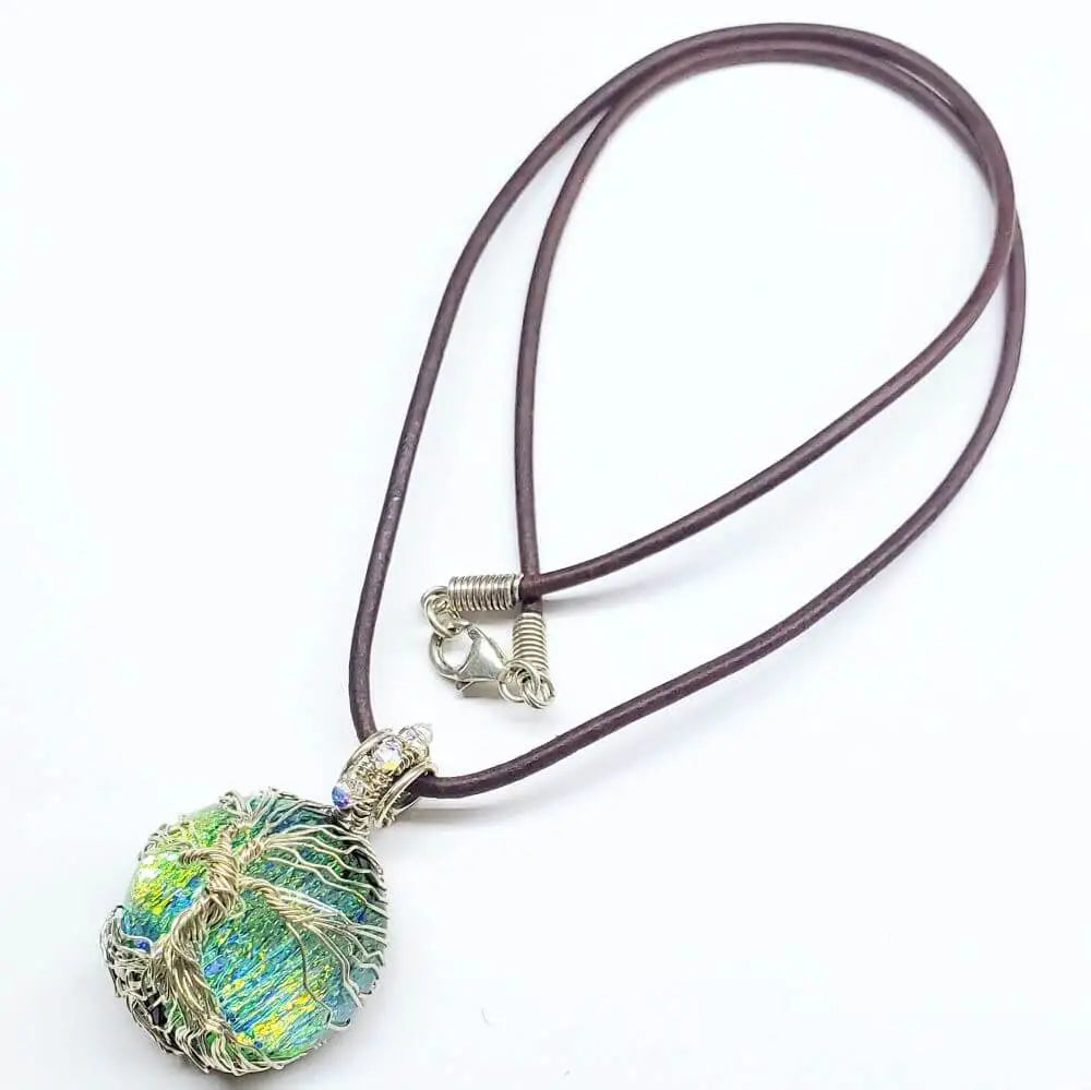 Handmade Tree of Life Dichroic Pendant Necklace with colorful glass and brown cord.