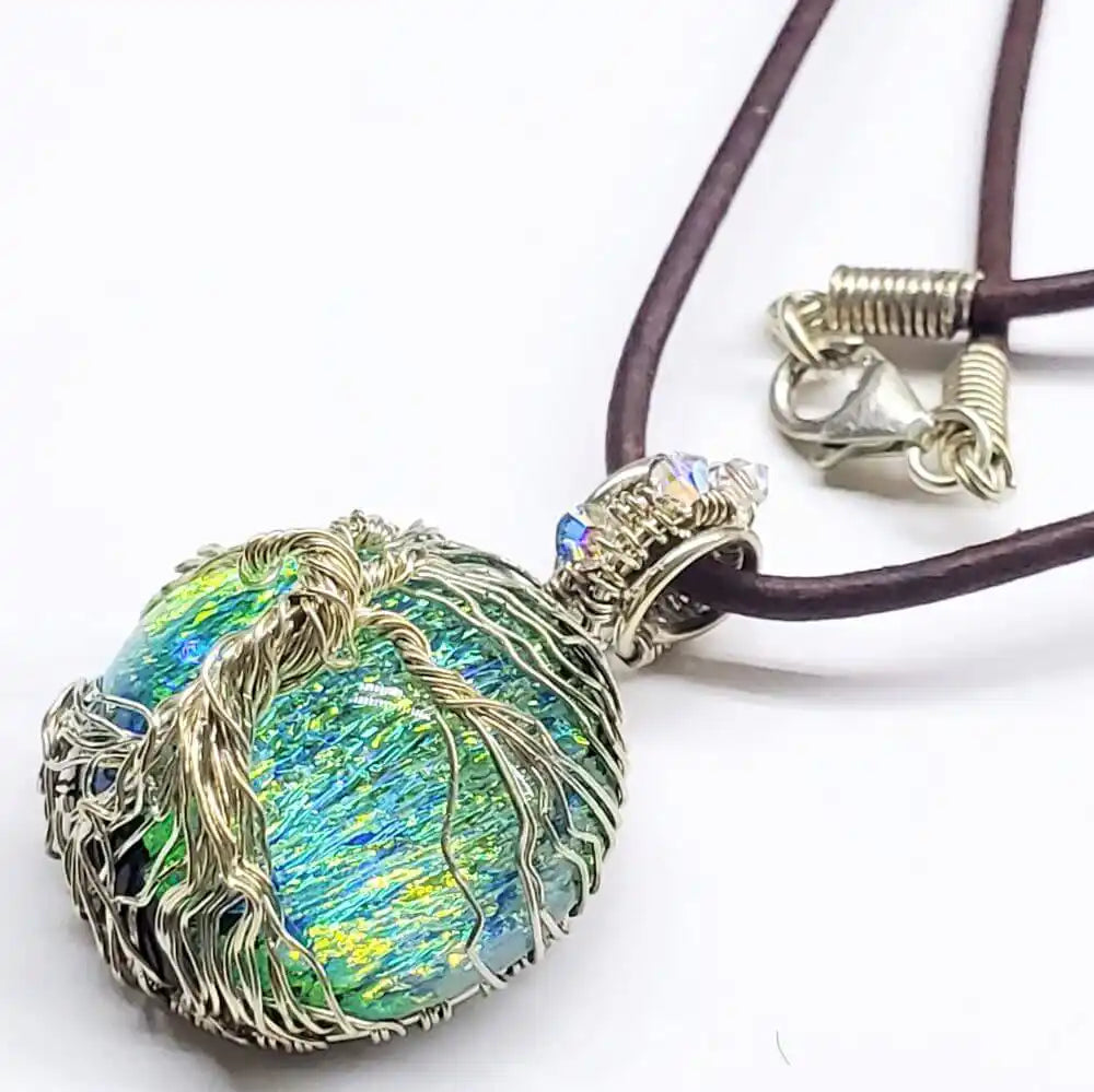 Handmade Tree of Life Dichroic Pendant Necklace featuring vibrant colors and intricate wire wrapping.