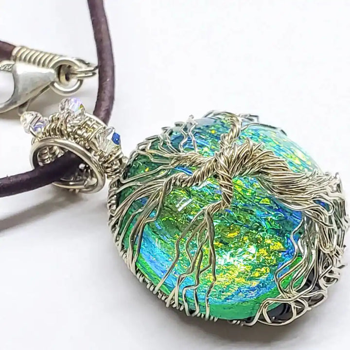 Handmade Tree of Life Dichroic Pendant Necklace featuring colorful dichroic glass and intricate wire wrapping.